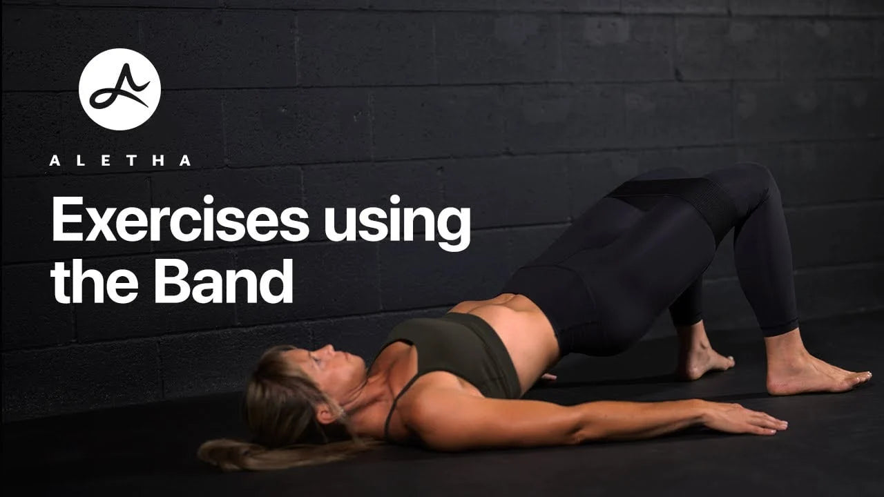 Woman performing exercises using a band 