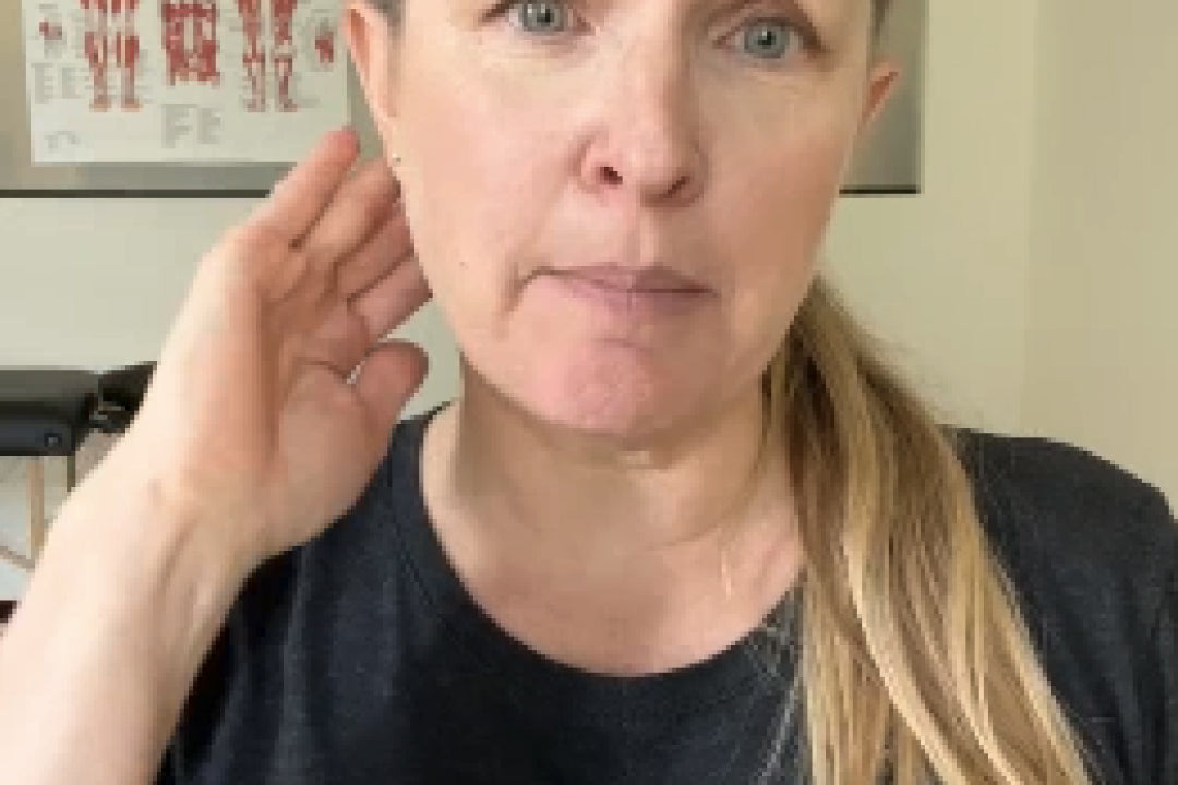 Woman holding her head indicating a headache issue.