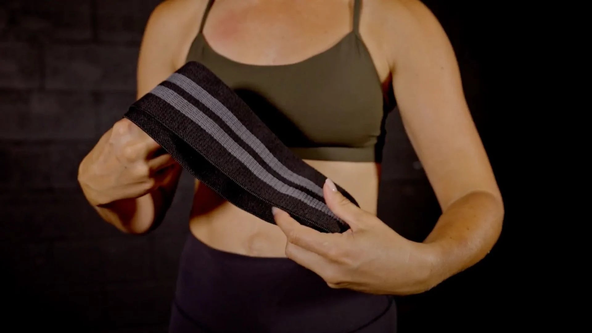 Person holding a black band 